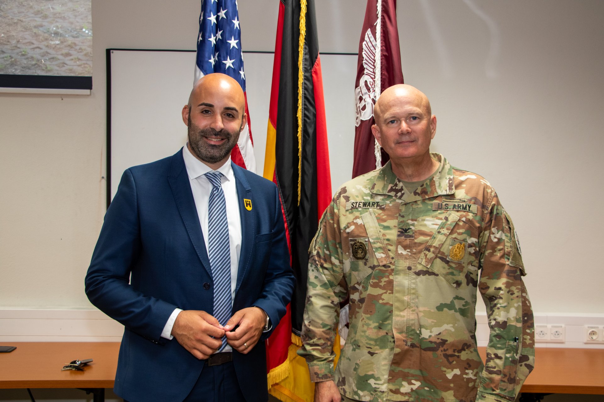 LRMC Change of Command U.S. Army Col. Warren Stewart assumes command of Landstuhl Regional Medical Center from Col. Theodore Brown during a change of command ceremony at Landstuhl, Germany, June 26, 2025. The ceremony marked the formal transfer of authority and responsibility for the U.S. military’s largest overseas medical center, which provides critical care to service members, their families, and beneficiaries across Europe, Africa, and the Middle East. (DoD Photo by Travis Jones)